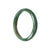 A beautiful half moon-shaped green jadeite bangle with a 57mm diameter, crafted from high-quality Grade A jadeite.