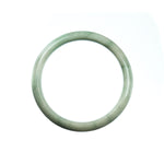 A pale green Burmese jade bracelet with a half moon design, measuring 57mm.