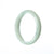 A pale green jade bangle bracelet with a half moon design, measuring 57mm in size.